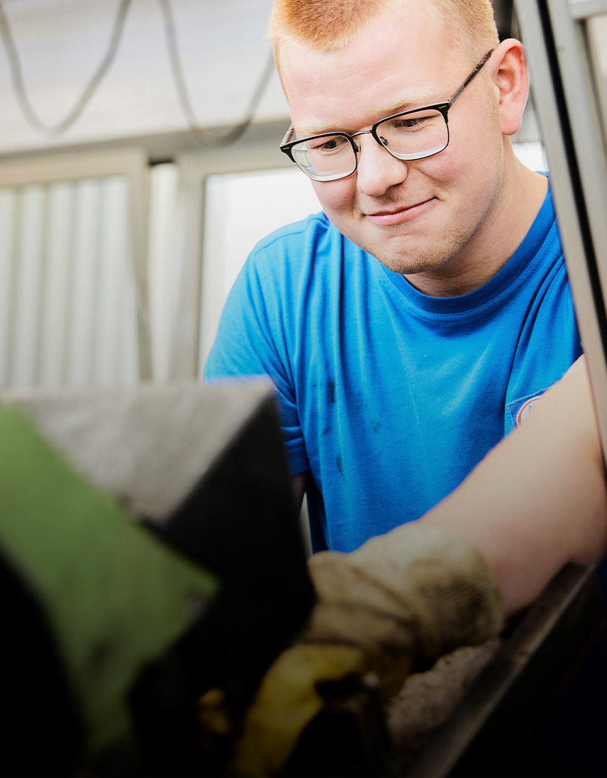 A man is working on a machine.